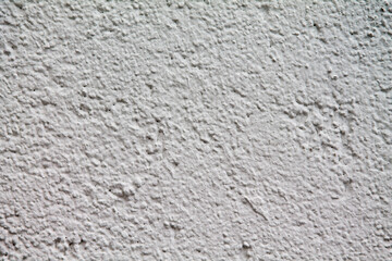 Texture of a rough plaster wall. Freshly whitewashed.