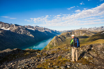 A hiker enjoying a world class view in Jotunheimen Norway
