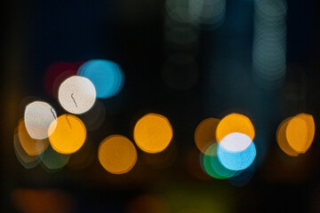 orange-blue circles reflection of lanterns at night