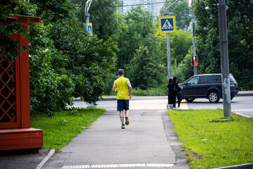 running athlete in a yellow t-shirt on the track