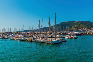 Fototapeta na wymiar A view across the marina looking to the headland at La Spezia, Italy in the summertime
