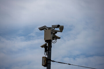 complex of security cameras in a recreation park against the sky