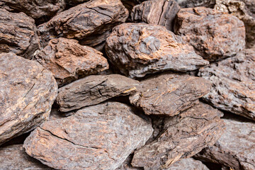 Dry charcoal pile stacked in basement