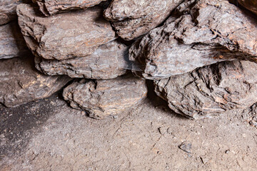 Dry charcoal pile stacked in basement