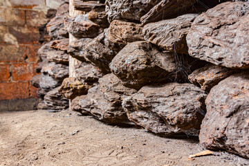 Dry charcoal pile stacked in basement