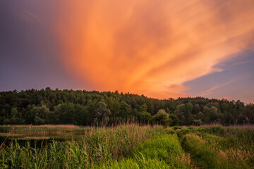 Obraz premium Fantastic beautiful sunset evening view on lake in Stradch, Lviv district. june 2020. Long exposure shot.