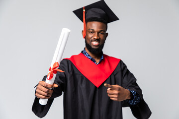 Young happy african american man student holding graduation certificate exciting expression...