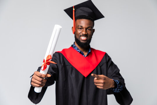Young happy african american man student holding graduation certificate exciting expression isolated on white background