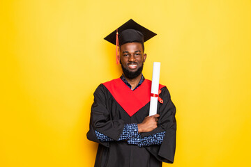 African American man college graduate with diploma isolated on yellow background