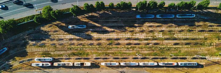 Evening aerial shot of Lukyanivka tram park in Kyiv., Ukraine. Abandoned tram car in depot - 364077655