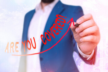 Writing note showing Are You Covered Question. Business concept for asking if they had insurance in...