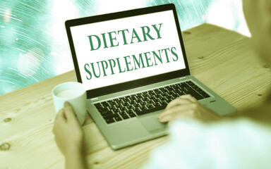 Handwriting text writing Dietary Supplements. Conceptual photo product intended to supplement the...