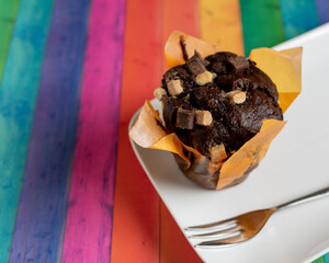 chocolate brownie muffin cake on a plate with bright background 