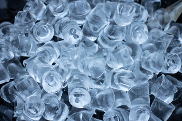 Cubes of ice crystals, flat lay background. Soft focus