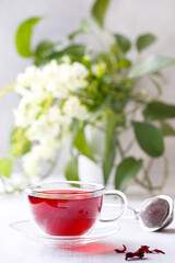 Healthy hibiscus tea in transparent cup