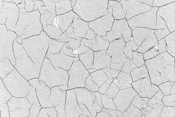 a lot of large cracks in the paint - black and white texture of the surface of an old metal plate