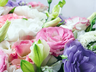 a bouquet of flowers of pastel shades close up - plant background