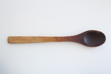 isolated old wooden spoon on a white background
