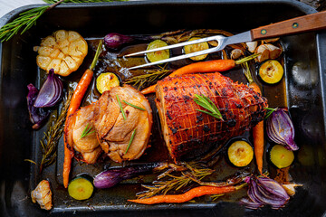 Lecere roll roast with vegetables and herbs.