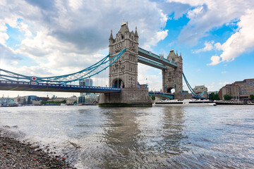 Fototapeta na wymiar Iconic Tower Bridge in London in the late afternoon. The bridge crosses the River Thames close to the Tower of London