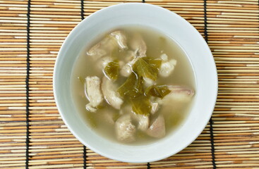  boiled pork leg and belly with cowa leaf soup on bowl