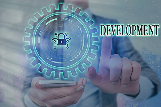 Writing note showing Development. Business concept for a cycle in which somebody or something grows or changes Graphics padlock for web data information security application system