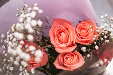 wedding rings and roses bouquet