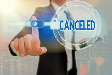 Conceptual hand writing showing Canceled. Concept meaning to decide not to conduct or perform...