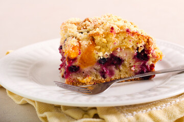 Fruit and berry cake with crumble topping