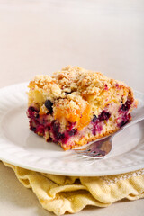 Fruit and berry cake with crumble topping