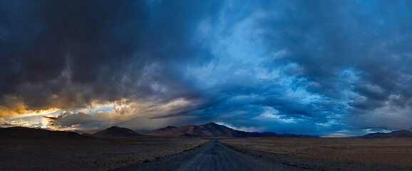 Tajikistan. Dramatic evening sky over the Pamir highway in the area of the high-altitude lake Bulunkul.