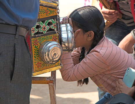 Bioscope being watched by a child in a fair
