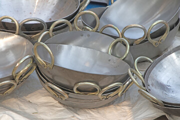 Thick, circular, and deep Iron cooking pots