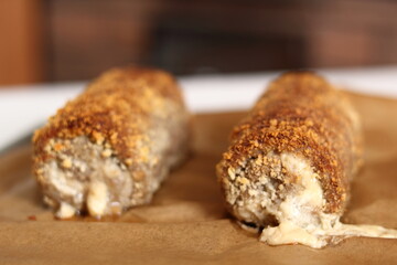 Meat roulade. Rolled meat with a filling of cheese and ham.