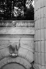 Detail of Greek Theatre column and stone carving in the forest park of Guild Sculpture Gardens...