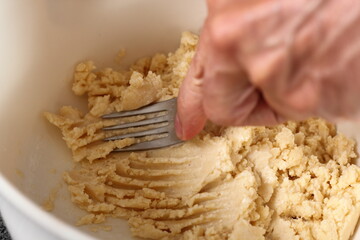 Stirring dough with water. Making Shoofly Tart Series.