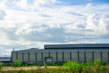 Fototapeta na wymiar Modern factory building with sunrise sky, Industrial factory background