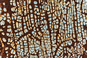 Rusty painted metal. Texture of rusty iron wall. Cracked paint on an old metallic surface. Cracked...