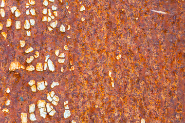 Rusty painted metal. Texture of rusty iron wall. Cracked paint on an old metallic surface. Cracked and flaky paint, abstract rusty metal texture, rusty metal background. Metal corrosion