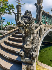 Closeup view of dragon statue on the bridge in Tirta Gangga temple, Bali