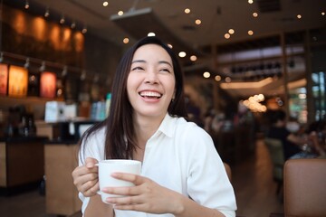 Happy woman drinking coffee in the morning.