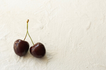 On a white background sweet cherry. Place for photo.
