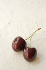 On a white background sweet cherry. Place for photo.
