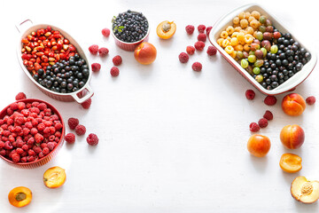 Composition with a variety of fresh berries and fruits