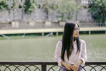 Asian girl with landscape nature in vintage tone, Hipster style of asian women is outting on weekend
