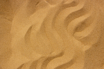 Fototapeta na wymiar Texture of clean sand on the beach, yellow sand background on vacation by the Mediterranean sea.