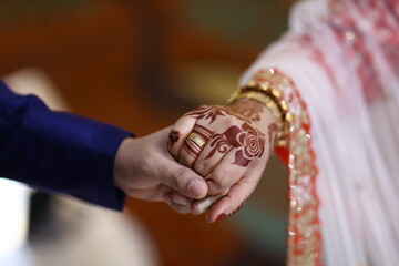 Bride and Groom Closeup hands  and dress 