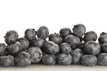 Ripe juicy organic blueberries, close-up, isolated on white.