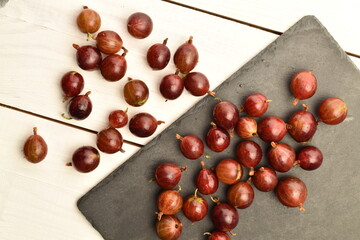 Ripe organic agrus, close-up, on a white wooden table.