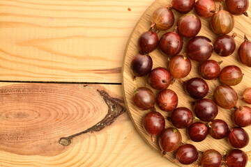 Ripe organic agrus, close-up, on a wooden table.